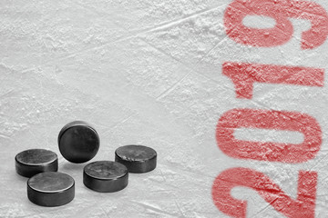 Hockey puck on the ice of the stadium