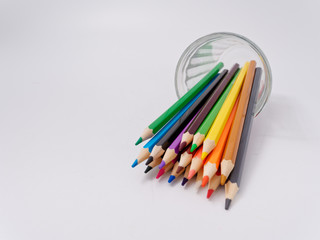 colored pencils sharpened on a white background.