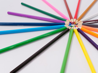 Fototapeta premium colored pencils sharpened on a white background.
