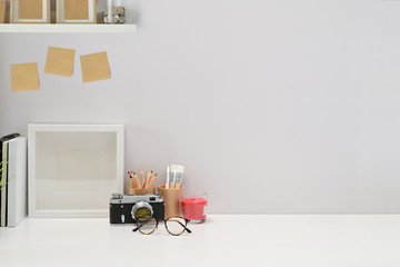 Minimalist stylish workspace poster, home office supplies, vintage camera and copy space