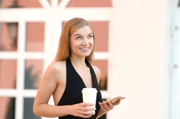 Woman satisfies with accomplished online payment successfully on mobile looking away