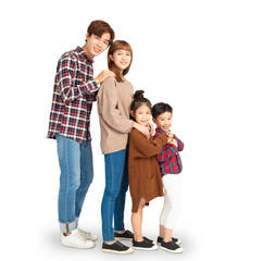 asian family smiling and standing together