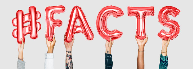 Hands holding #facts word in balloon letters