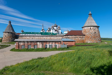 Fototapety  Spaso-Preobrazhensky Solovetsky Monastery and the ruins of a power station building in the summer day, Russia
