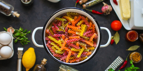 pasta, fusilia, italian food (multi-colored) set of ingredients. top .. food background copy space