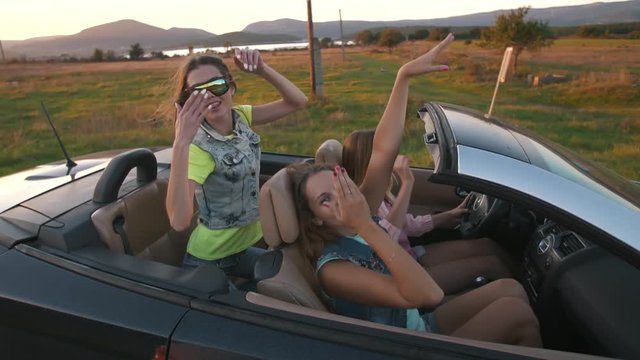 Young women in a convertible car