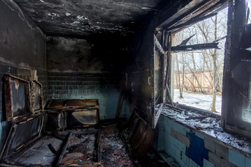 Burned interiors after fire of industrial or residential building. Fire consequences concept