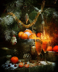 Fototapeta na wymiar Christmas still life with champagne and mandarins