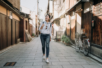 backpacker walking on road in ishibe alley kyoto