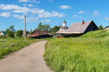 ISLAND SOLOVKI, RUSSIA - JUNE 26, 2018: View of houses in the village of Solovki on a polar summer day, at sunset.  Arkhangelsk region, White Sea © Konstantin