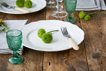 Spring table setting with green chrysanthemums