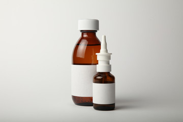 Medical glass bottle and spray mockup. Empty white label.
