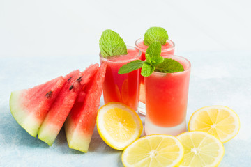 Watermelon mohito in glasses with lemon and mint