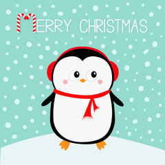 Merry Christmas. Penguin on snowdrift. Red headphones hat. Happy New Year. Cute cartoon kawaii baby character. Arctic animal. Flat design. Hello winter. Blue snow background.
