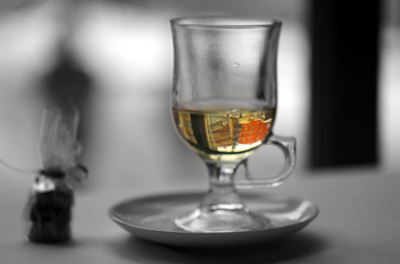 Macro photo of delicious green tea in a glass with cake