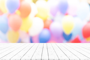 Perspective empty white wooden table on top over blur balloon background, can be used mock up for montage products display or design layout. - obrazy, fototapety, plakaty