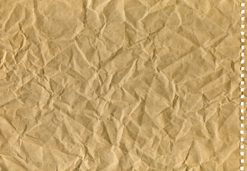 brown crumpled old kraft paper with perforation, background