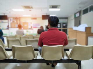adult man and many people waiting medical and health services to the hospital,patients waiting...
