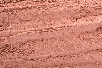 Cosmetic  red clay texture, background. Natural mask, dry clay for the face and body.
