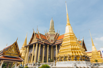 Fototapeta premium The beauty of the Emerald Buddha Temple . And while the gold of the temple catching the light. This is an important buddhist temple of thailand and a famous tourist destination.