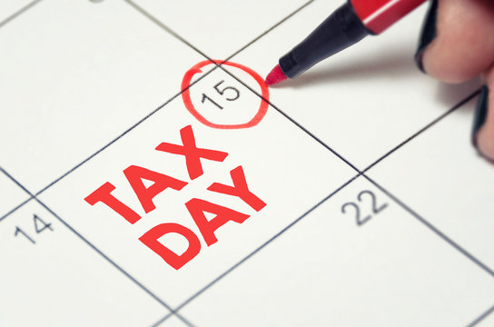 Tax day concept. The USA tax due date marked on the calendar.