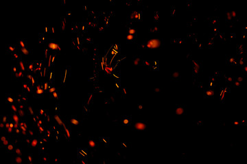 flame of fire with sparks black background