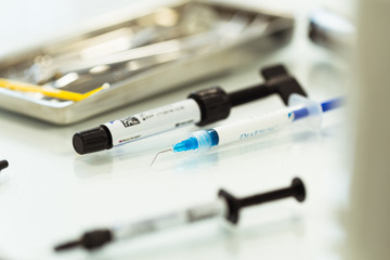 Different dental tools and syringe with anesthesia