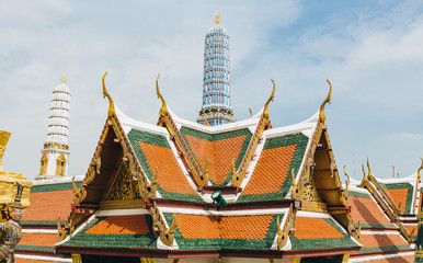 Fototapeta premium The beauty of the Emerald Buddha Temple . And while the gold of the temple catching the light. This is an important buddhist temple of thailand and a famous tourist destination.