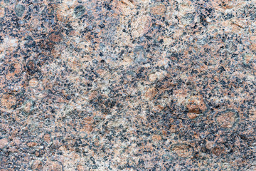 a fragment of a small area granite tiles as a background