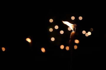 fakel with nice warm flame at night and in the background with a nice bokeh