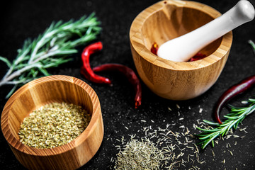 Rosemary, cumin and chili pepper on the table.