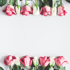 Flowers composition. Pink and white rose flowers on pastel gray background. Flat lay, top view, copy space, square © Flaffy