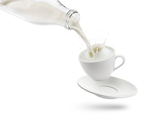 pouring milk into cup