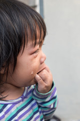 Portrait of crying baby girl.