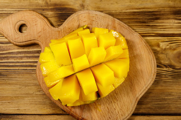 Fresh mango fruit on wooden table