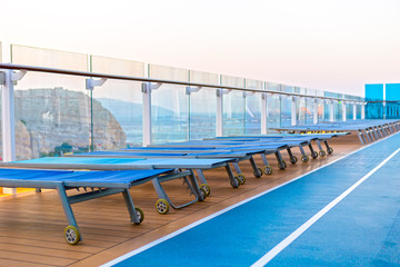 Lounge chairs on deck of cruise ship