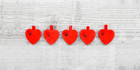 Red hanging hearts with ladybug