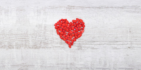 Red Pebble Stones on Wooden Background - Valentine's Day