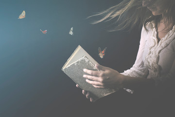 magical butterflies come out of a book read by a woman - obrazy, fototapety, plakaty