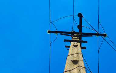 background electric pillar against the background of the blue sky