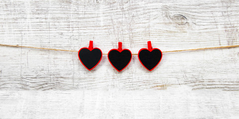 Valentines day with red hearts on wooden background