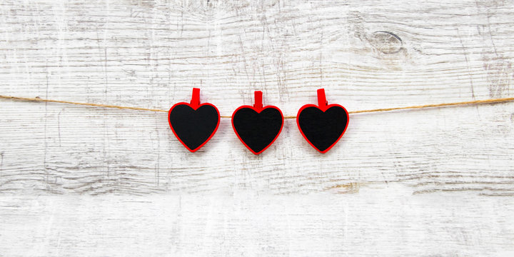 Valentines day with red hearts on wooden background