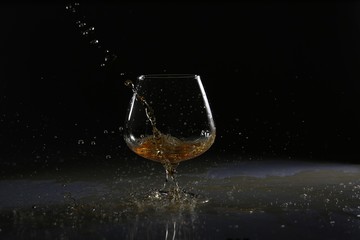 glasses and bottles for brandy and wine in the background