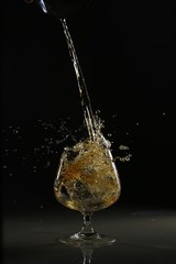 glasses and bottles for brandy and wine in the background