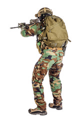 Portrait soldier or private military contractor holding sniper rifle.