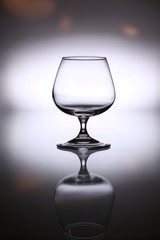 glasses and bottles for brandy and wine in the background