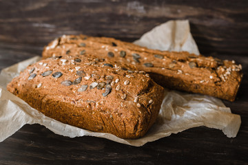 close up view of chrono breads on dark wooden background