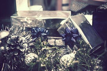 christmas gifts boxes with decorations, the picture has a blue tone and vintage effect