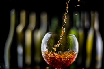 glasses and bottles for brandy and wine in the background