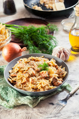 Creamy farfalle pasta with salmon, parmesan cheese and dill